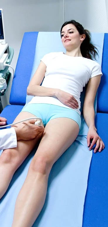 Mandatory Credit: Photo by Garo/Phanie / Rex Features (1178791i) Model released - Woman undergoing a Doppler ultrasound (angiodynography) scan of the legs to study blood flow and explore potential deep vein thrombosis. Various
